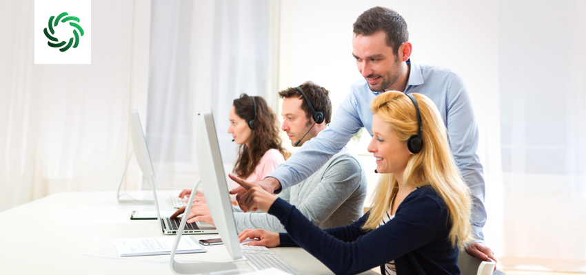 Call center supervisor reviewing AI-generated coaching insights from conversation intelligence software